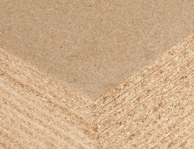 Detailansicht einer Spanplatte mit feiner Holzspanstruktur, ideal für Möbelbau und Innenausbau.